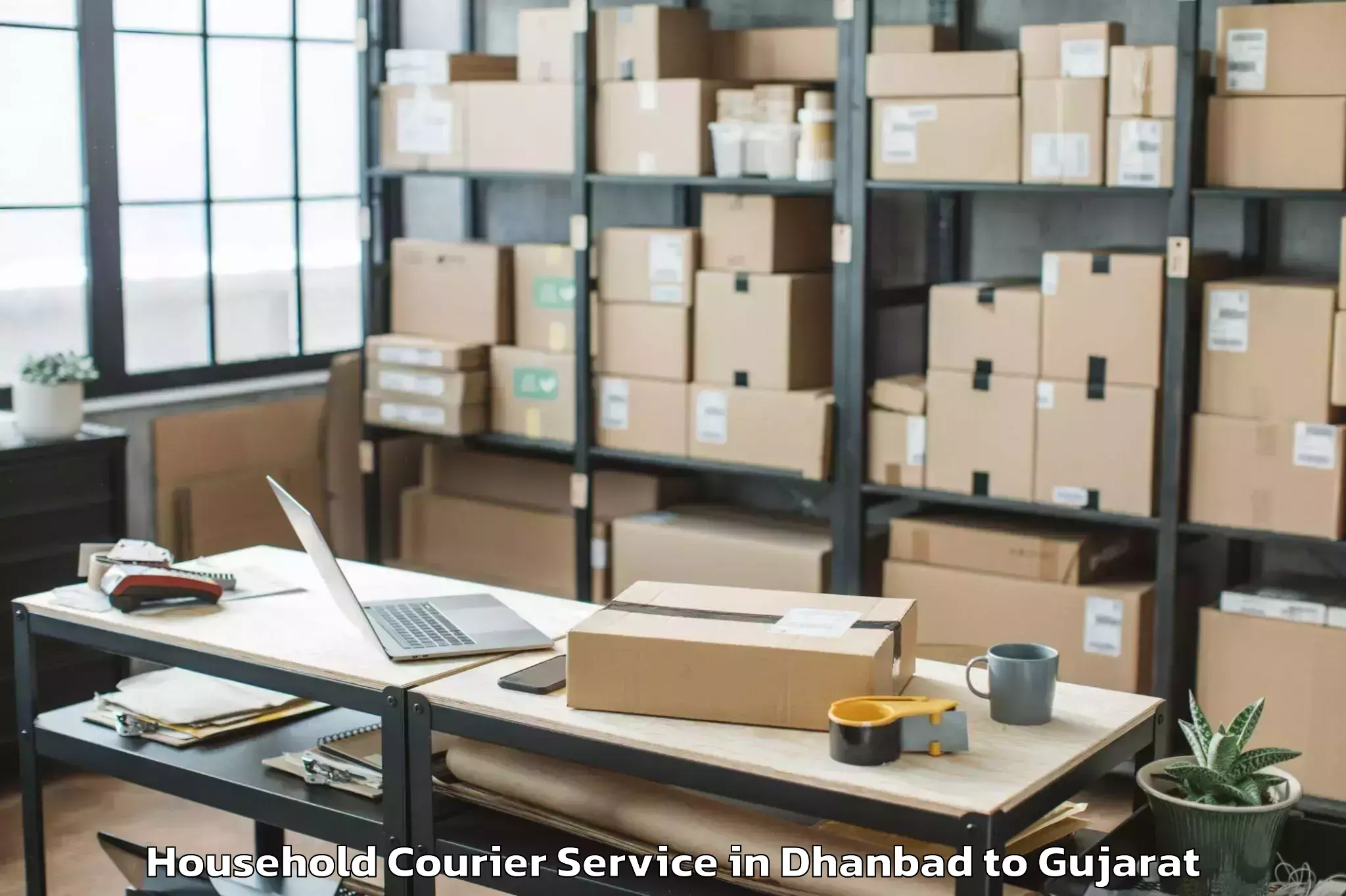 Affordable Dhanbad to Gujarat Ayurved University Jam Household Courier